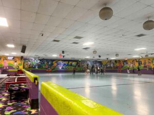 The roller rink at Skate Country in Tucson with a few roller skaters